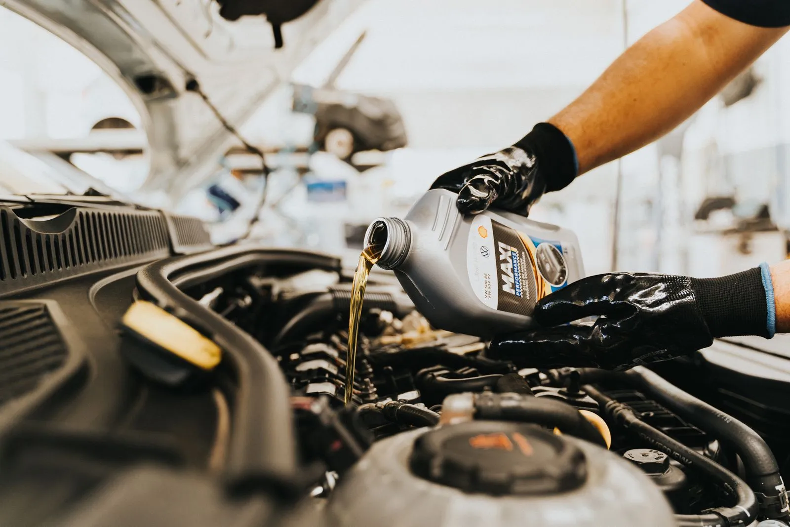 AMSOIL oil change service in an automotive service bay